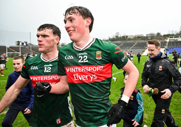 Mayo substitute Kobe McDonald leaves the field with his brother Jordan Flynn after the match in Clones. Pic: Sportsfile.