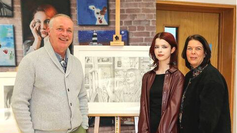 Charlotte Greham pictured with her parents and her artwork Inspiritation at the opening of the exhibition.
