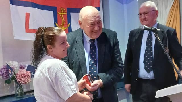 Dr Noreen Lineen-Curtis presented with her King’s Coronation Medal by RNLI trustee John Killeen