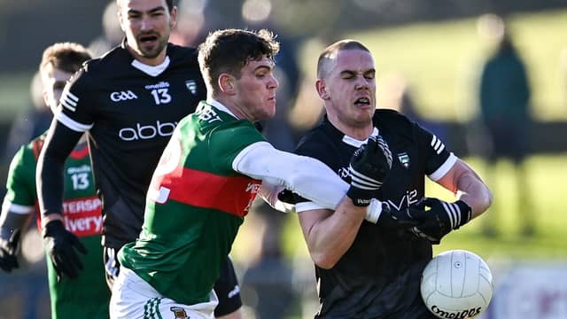 Mayo’s Jordan Flynn tackles Paul McNamara of Sligo during a chairty game in James Stephen’s Park in Ballina in 2023 (Piaras Ó Mídheach/Sportsfile)