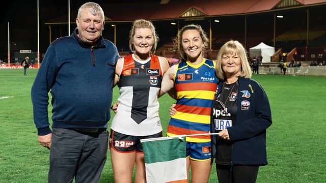 Jack Kelly (left) and Breda Kelly (right) with their daughters Grace (centre-left) and Nimah (centre-right) at the Norwood Oval in Adelaide after Adelaide Crows defeated St Kilda in the AFLW