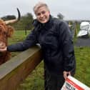 MEP Maria Walsh with Highland heifers cows on her family farm