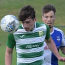 Castlebar Celtic's Eoin Hughes and Ballina Town's Chris Moore