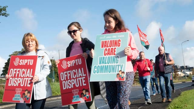 Section 39 workers carrying placards and flags during industrial reaction in Castlebar last year (Pic: Alison Laredo)