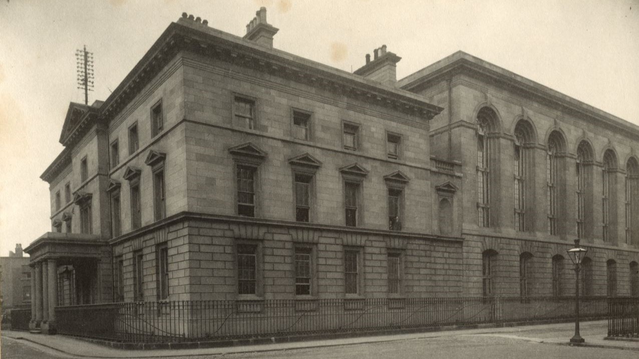 A gentleman standing in the ruins of part of the Four Courts (FitzGerald Photographs, UCD Archives)