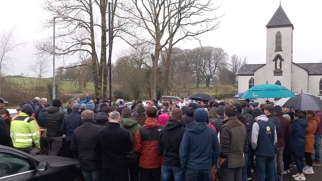 A public meeting held outside Crossboyne church to discuss the proposed modular accommodation for Ukrainian refugees in Claremorris