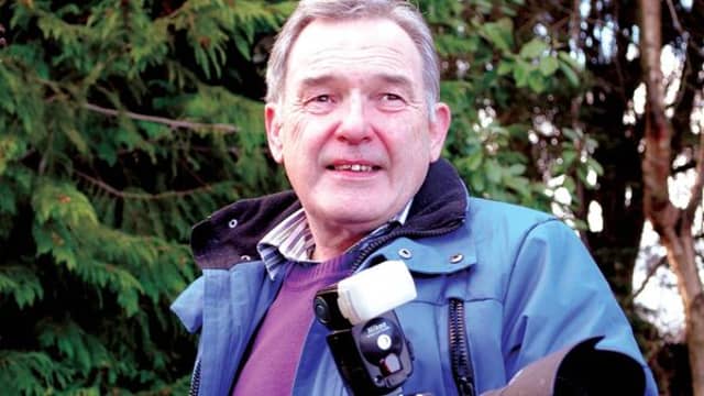 The late Western People photographer Henry Wills with his camera (Pic: Western People)
