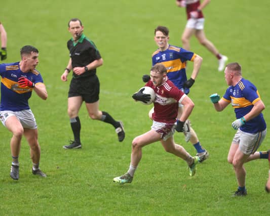 Crossmolina's James Maheady slicing through the Mayo Gaels rearguard during last Saturday's U-21 B final in MacHale Park. Pic: Michael Donnelly