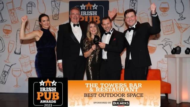 Tom Bourke (centre) pictured receiving the award for Best Outdoor Space at the Irish Pub Awards