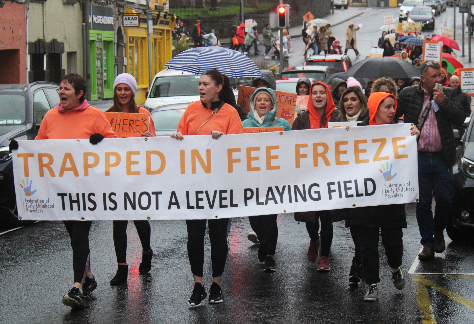 Demonstrators marching through Castlebar in protest against the government's childcare policies