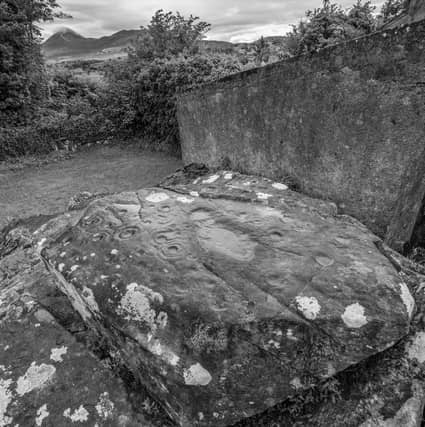 A new book and immersive experience claims to unlock the mystery of the markings on stones like the Boheh Stone. Pic: Karen Cox