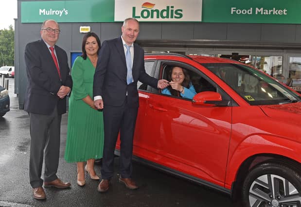 Winner Sinead O'Malley receiving the keys of the car from Alan Mulroy alongside Mike Smith and Martina Jennings of Mayo Roscommon Hospice