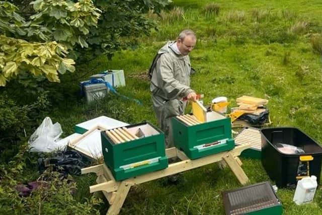 Dr Sean O’Connor with the Inishturk bee hives, equipped of a technology to advance native Irish honey bees research