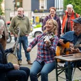 Pictured are Enda Scahill, Erynn Marshall & Carl Jones performing in Westport