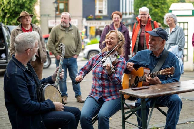 Pictured are Enda Scahill, Erynn Marshall & Carl Jones performing in Westport