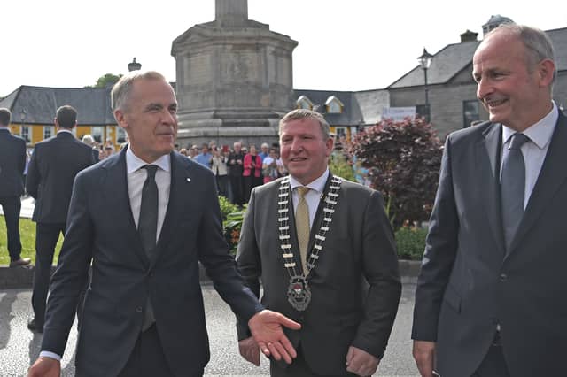 Mark Carney with Cllr Seán Carey and An Taoiseach Micheál Martin on his visit to Westport