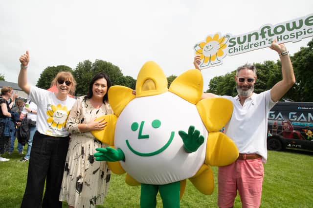 Anna Connolly, Mayo Roscommon Hospice, Martina Jennings, CEO Mayo Roscommon Hospice, Sunny and Cormac Kearney CEO of Pamex Ltd at the Sunflower Chidren's Hospice Family Fun Day at the Mall, Castlebar.