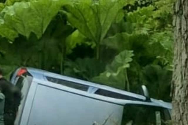 A car overturned on the Westport to Louisburgh road at Killadangan.