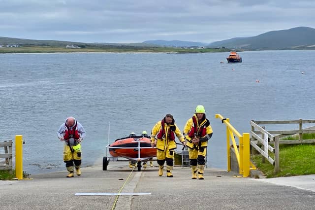 The volunteer crew, including Coxswain PJ Walker, Mechanic Trevor Devereux, and crew members Gerry Martin, Hughie Carolan, Stephen Togher, and Sean Reilly, launched the all-weather lifeboat with a full crew of six.