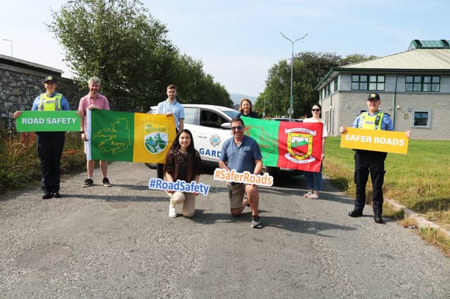 JOINT INITIATIVE: Kerry and Mayo supporters promoting road safety with gardaí.