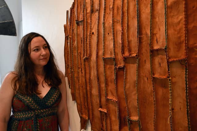 Australian-born, Mayo-based artist Christine Prescott beside her work, 'Find Something to Love'