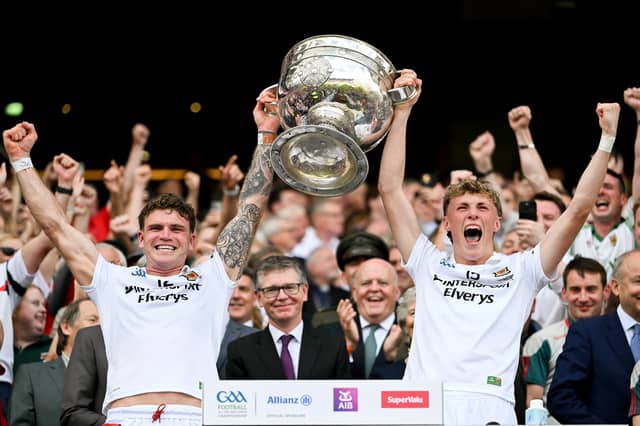 Brothers Jordan Flynn and Kobe McDonald lift the Sam Maguire cup in Croke Park.