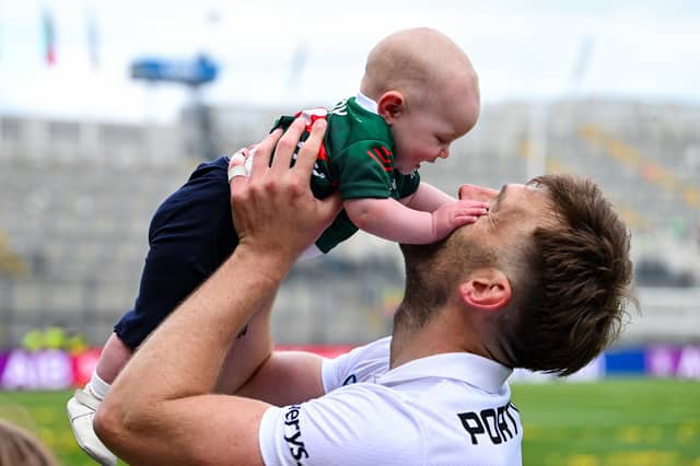 Adian O’Shea celebrating the win with his daughter Romee