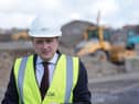 Pictured is Housing Minister James Browne.