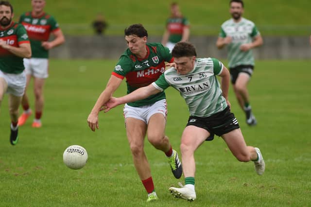 Kilmaine's Adam Barrett and Islandeady's Liam Coyne compete for possession in St Feichin's Park, Cong. Pic Conor McKeown.