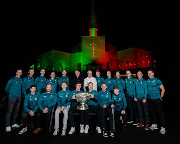 Fr Richard Gibbons and Archbishop Francis Duffy with members of the Mayo All-Ireland team and backroom members after a special thanksgiving prayer service at Knock Shrine yesterday evening. 
