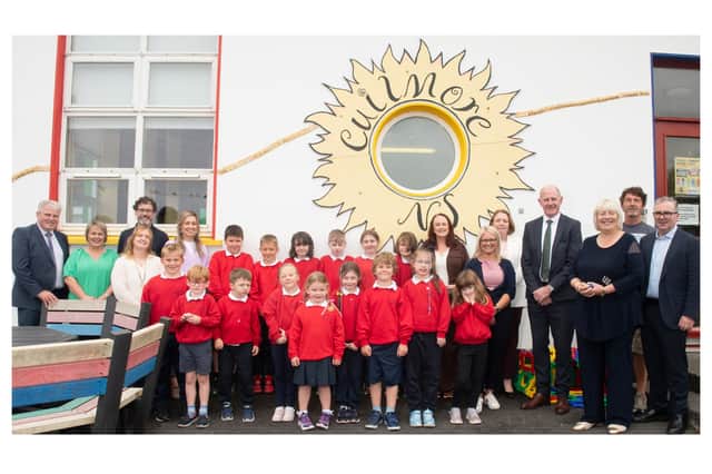 Pupils and staff of Cuilmore Community National School with representatives from MSLETB