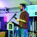John Armstrong reading an excerpt from his story at the 2025 Wild Atlantic Words prize-giving event in the Festival Dome