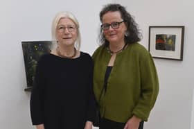 ON HOME GROUND Mags Duffy (right) at the opening of her exhibition 'The Faraway Nearby' at the Custom House Studios gallery. She is pictured with local poet Geraldine Mitchell, who performed the opening. 