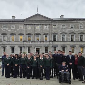 Students and staff from St Louis Community School pictured with TD Paul Lawless in front of Leinster House