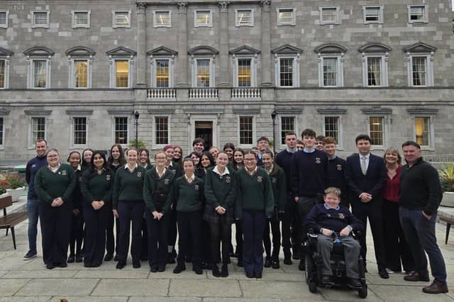 Students and staff from St Louis Community School pictured with TD Paul Lawless in front of Leinster House