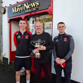 Westport United players Dan O'Malley and Mark McDonagh with out Head of Sport Michael Gallagher