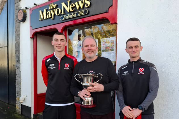 Westport United players Dan O'Malley and Mark McDonagh with out Head of Sport Michael Gallagher