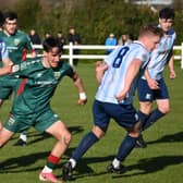 Pictured is Salthill Devon's Timmy Molloy beating Mayo's Guga Kolaia to the ball in today's FAI National League game in Umbro Park. Pic: John Corless.