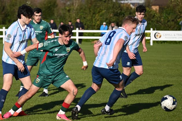 Pictured is Salthill Devon's Timmy Molloy beating Mayo's Guga Kolaia to the ball in today's FAI National League game in Umbro Park. Pic: John Corless.