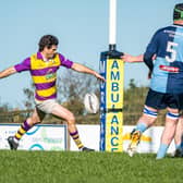 Ballyhaunis scrum-half Rowan Gouws kicking the ball against Castlebar. 