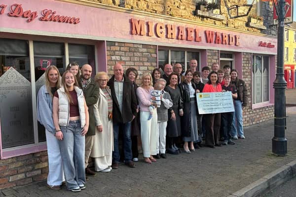 The Warde family gathered together outside Warde's pub for a photo and a cheque handover to the Mayo Roscommon Hospice Foundation