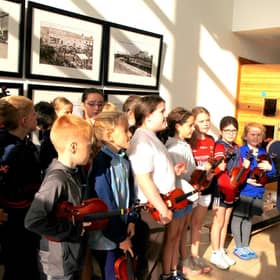 Minister Dara Calleary speaks to young musicians from Music Generation Mayo Erris Strings Project at Aras Inis Gluire