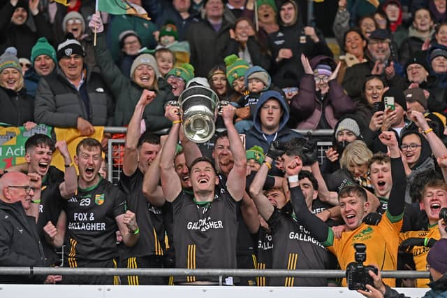 James Carr hoists the Pete McDonnell Cup to the heavens as Ardagh are crowned county champions.