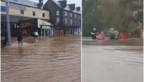 Cork floods: Gardaí in Storm Babet warning as footage emerges of people waist high in water