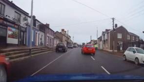 WATCH: Terrifying moment 'maniac' driver nearly collides with cyclist before running red light