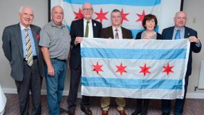 Flag presentations cement relationship between Westport and Chicago