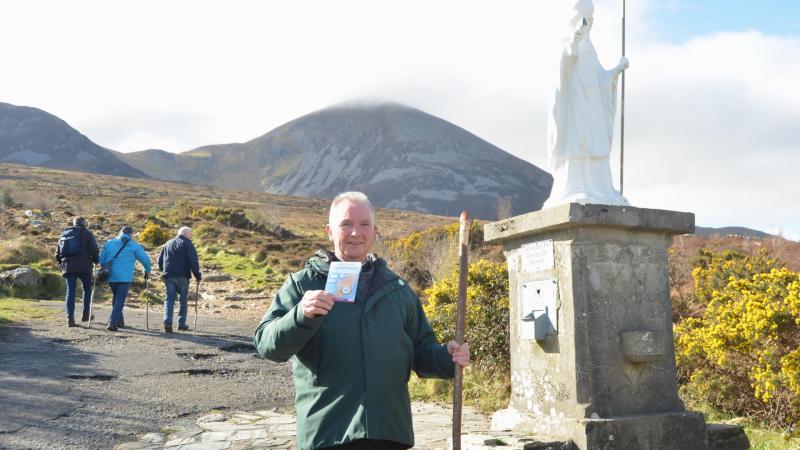 Fr John Kenny from Westport launches Pilrgrim Passport at Croagh Patrick