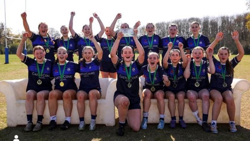The Sacred Heart Westport rugby team celebrating with the 7s trophy. 