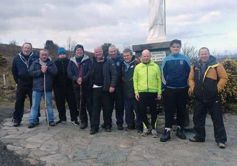 Westport duo climb Reek one backward step at a time