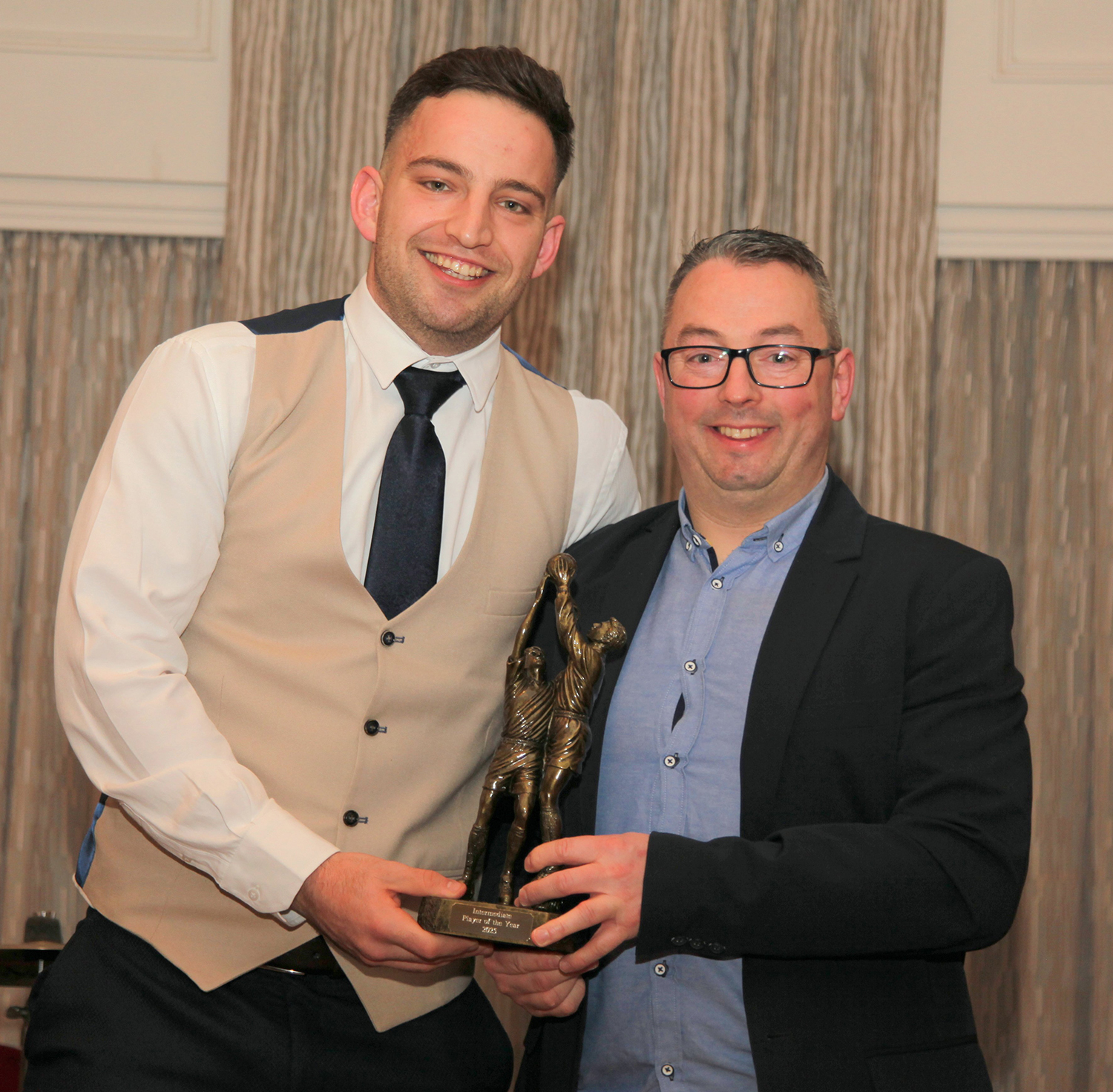 Intermediate Player of the year 2025 Evan O'Brien receiving the award from Ruairi Keane, Intermediate management.